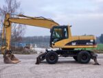 Pelle sur pneus Caterpillar M318C 2005 – 19,7T – Occasion